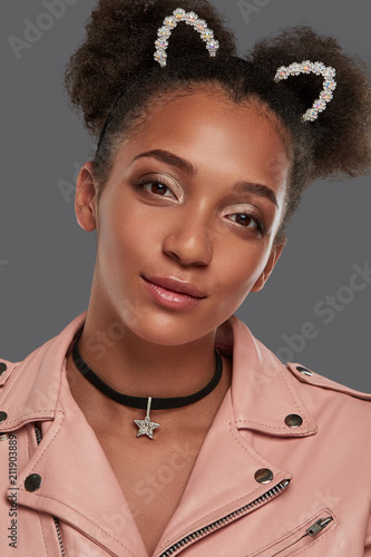 A Close Up Portrait Of A Young African Lady In A Pink Biker