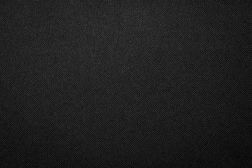 Black fabric texture background. Dark clothing material.