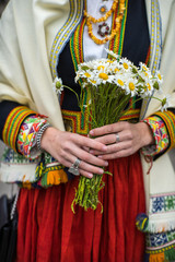 Wall Mural - Song and dance festival in Latvia. Procession in Riga. Elements of ornaments and flowers. Latvia 100 years.