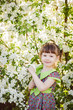 © Elmina - happy little girl in a blooming garden