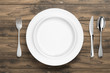 © pixelkorn - Dinner Ware On Rustic Wooden Table