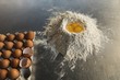 © Wavebreak Media - Close up of flour with egg yolks on countertop