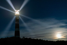 Lighthouse Rotating Beams At Night, Island Of Ameland, Hollum, Friesland, Netherlands