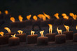 Burning memorial candles on dark background