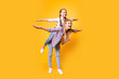 Friendship casual clothes older adult two different blonde haired concept. Full length body size view photo of funky rejoicing joyful sibling holding carrying sister on back isolated bright background