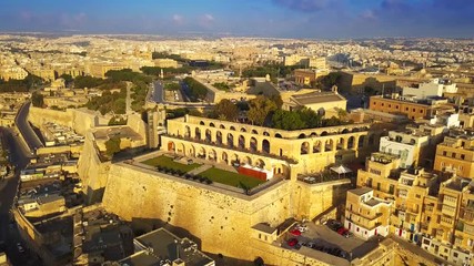 Wall Mural - Valletta, Malta - 4K flying around of Saluting Battery early in the morning with Upper Barrakka Gardens at background