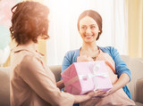 Fototapeta Panele - Friend Giving to Pregnant Woman Gift in Pink Box.
