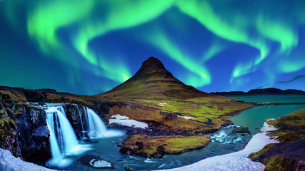 northern light, aurora borealis at kirkjufell in iceland. kirkjufell mountains in winter.