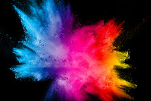 Multi Color Powder Explosion Isolated On Black Background.