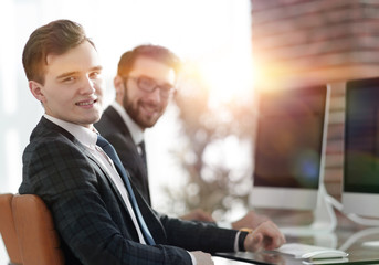 Canvas Print - young Manager at his Desk.