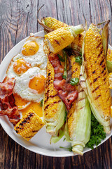 Wall Mural - close-up of barbecued corn in cobs