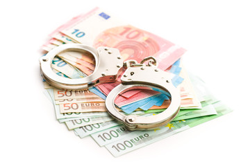 Handcuffs and euro money.