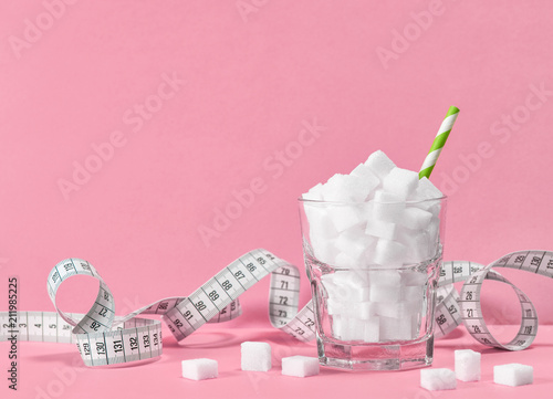 Fotografía Glass sugar cubes measuring tape Weight control diet