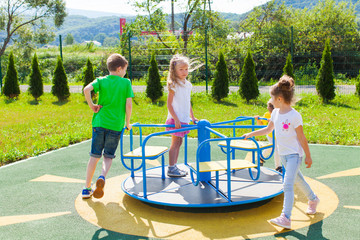 Wall Mural - Siblings rest on the playground