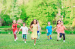 © davit85 - Many different kids, boys and girls running in the park on sunny summer day in casual clothes
