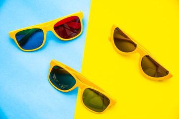 Top view for sunglasses on a colorful background.