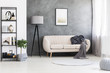 Poster mock-up on a gray, concrete wall and a leather beige settee in an industrial living room interior with black, wooden furniture