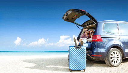 Poster - Summer trip on beach. Big blue car with two people. Free space for your text. 