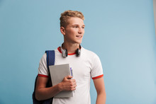 Portrait Of A Smiling Casual Teenage Boy With Backpack