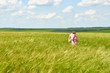 © soleg - child walking through the wheat field, bright sun, beautiful summer landscape