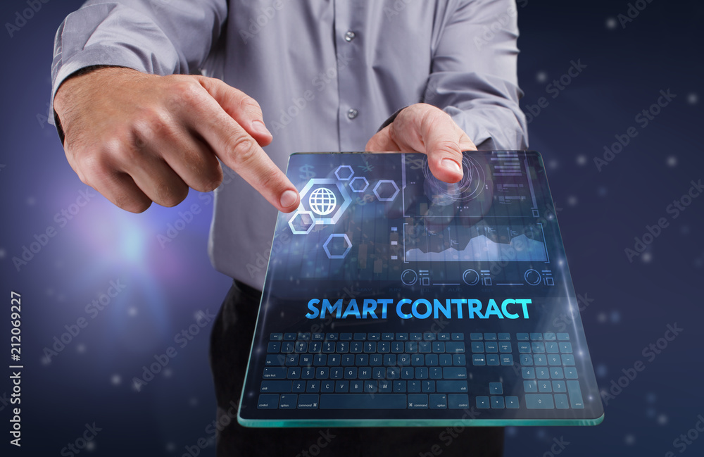 The concept of business, technology, the Internet and the network. A young entrepreneur working on a virtual screen of the future and sees the inscription: smart contract