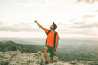 © Rafa - Man on the mountain pointing towards the sky. Guy practicing trekking