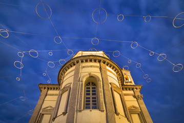 low view to old church in twilight time with blue sky in Italy