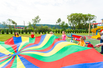 Colorful pice of cloth waved by chidren