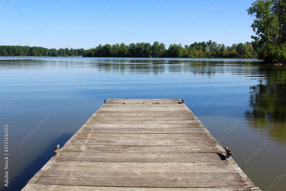 The small wood dock and the reflection lake of the park. - obrazy, fototapety, plakaty 