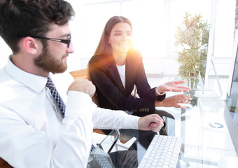 Sticker - businessman and his female assistant sitting at a Desk