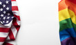 © ink drop - American stars and stripes flag alongside a gay Pride LGBT rainbow flag