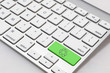 White keyboard with a green 