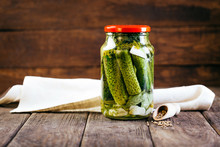 Canned Cucumbers In A Jar On A Wooden Background, Harvesting Vegetables, Pickles