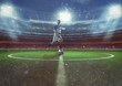 © alphaspirit - Soccer player hits the ball from the midfield at the stadium