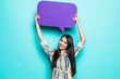 © F8  \ Suport Ukraine - Young woman holding a speech bubble on a blue background