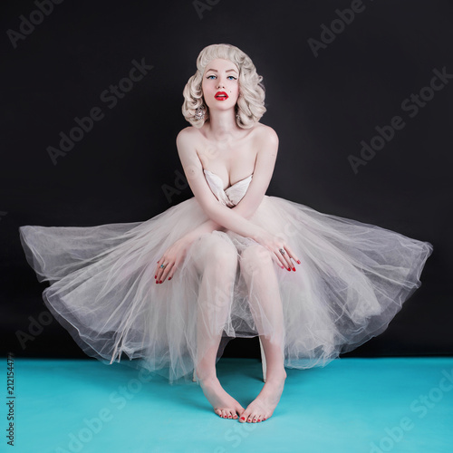 Carta da parati  Beautiful blonde sexy woman with birthmark on face on black background