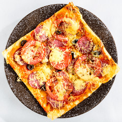 Poster - Appetizing pizza with salami, cheese and tomatoes on light backg