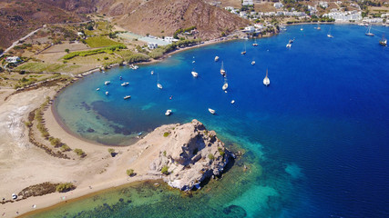 Aerial birds eye view photo taken by drone of famous rock of Kalikatsou in Petra beach, Patmos island, Dodecanese, Greece