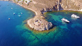 Fototapeta  - Aerial birds eye view photo taken by drone of Groikos one of the most beautiful natural bays in the world, Patmos island, Dodecanese, Greece