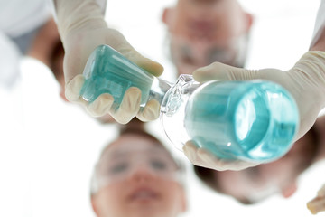 Wall Mural - image is blurred. beakers in hand, and scientists