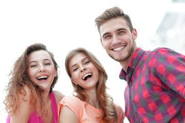 Canvas Print - closeup of three young people smiling on white background