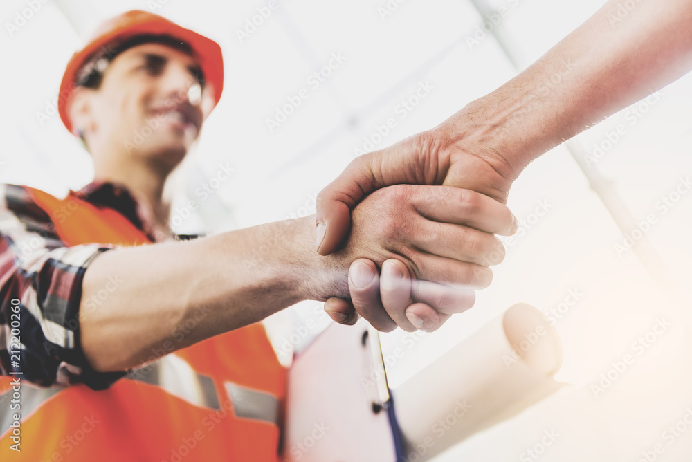 Close up. Engineer Greeted Man with Handshake. - obrazy, fototapety, plakaty 