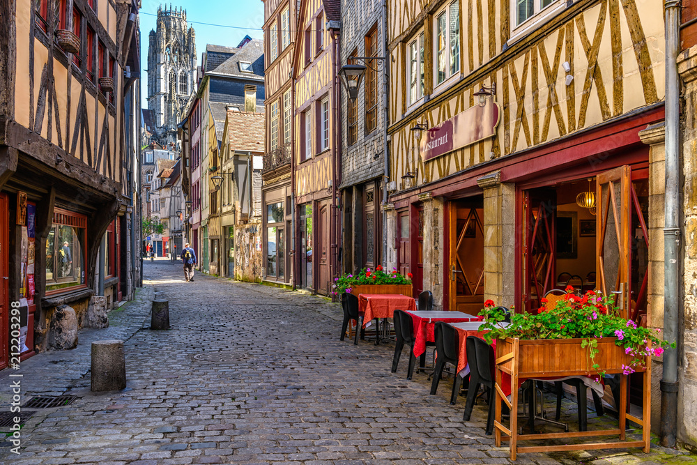 Cozy street with timber framing houses and tables of restaurant in Rouen, Normandy, France - obrazy, fototapety, plakaty 