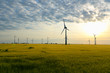 canvas print picture - renewable energies - power generation with wind turbines in a wind farm 