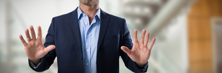 Poster - Composite image of businessman touching the invisible screen