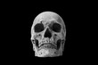 Human skull on black background