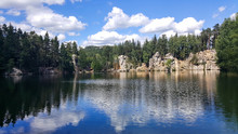 Adrspach. The Sky Is Reflected In The Water Of The Lake With Rocks And Trees On The Shore