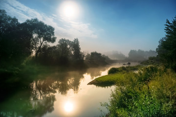 Wall Mural - landscape with moon light at night over river. fog above water and trees