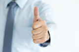 Fototapeta  - Close-up of a businessman with thumbs up