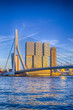 Famous Travel Destinations. Attractive View of Renowned Erasmusbrug (Swan Bridge) in  Rotterdam in front of Port and Harbour. Picture Made Before the Sunset.